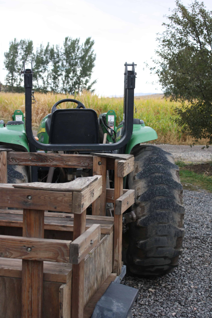 Tractor pulling a wood wagon